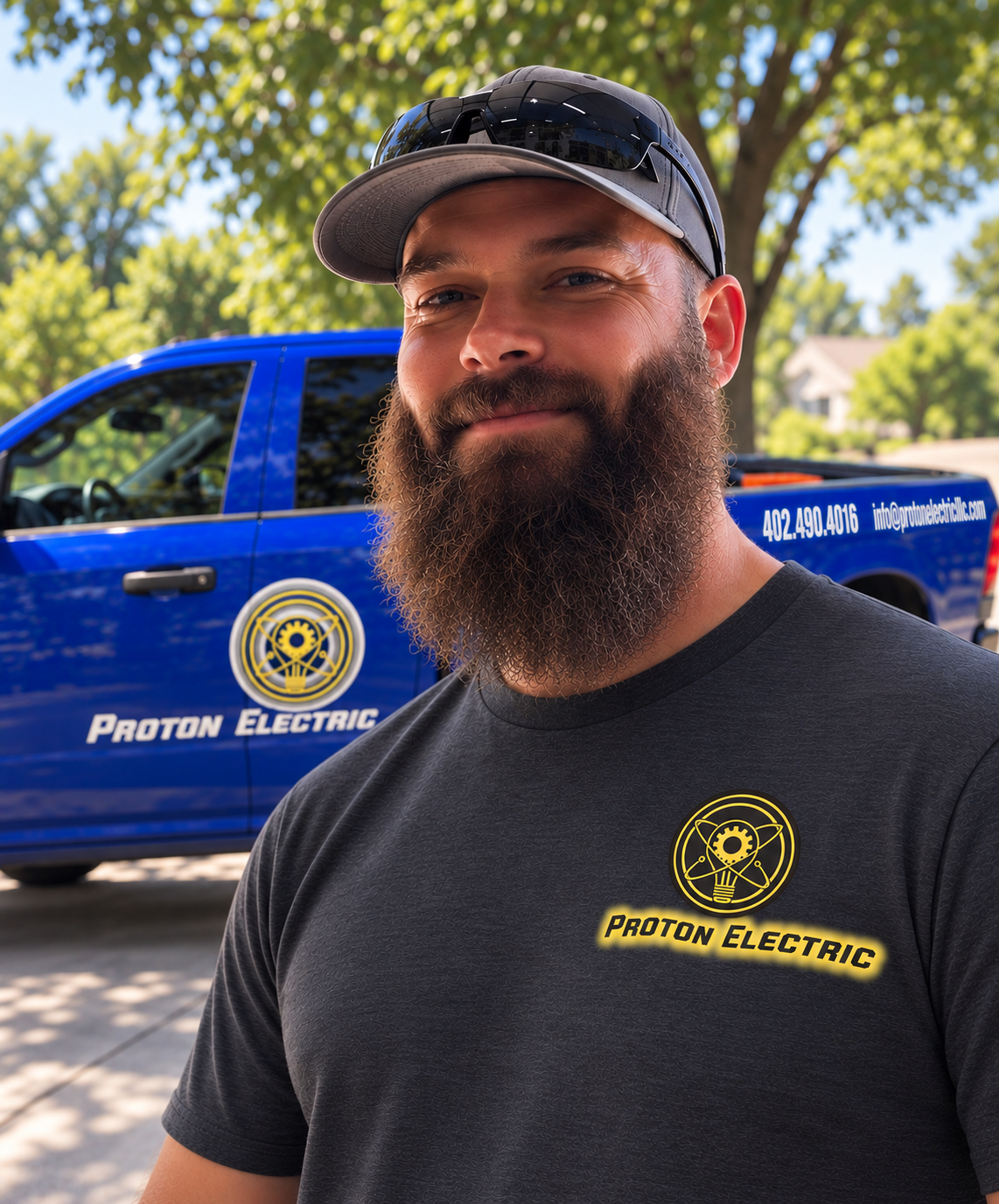 Derek Curtis, owner and licensed electrician at Proton Electric, in front of his Proton Electric truck